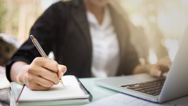 A woman writing her own medical device regulation documentation