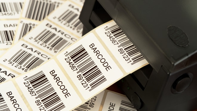 A label maker printing bar-code labels.