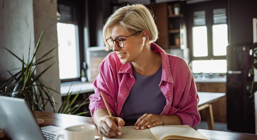 A woman reading & taking notes on a Medical Device Regulation article